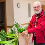 Alaska Food Hub customer Roger Clyne picks up his order at one of the Food Hubs designated locations in this undated photo. (Photo courtesy of Robbi Mixon/Alaska Food Hub)
