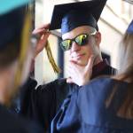 Isabella Koch helps Garrett Koch perfect the finishing touches before they walk in their graduation ceremony Tuesday, May 21, 2019 at Ninilchik School in Ninilchik, Alaska. They are two of four total Ninilchik graduates this year. (Photo by Megan Pacer/Homer News)