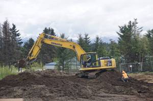 Photo by Michael Armstrong/Homer News                                Construction workers do foundation work at the site of the new Homer Police Station on Grubstake Avenue and Heath Street uphill of the Homer Post Office on May 20 in Homer.