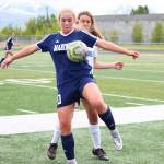 Homers Paige Jones sneaks in front of Palmers Natalia Bonadio to get the ball on the throw in during a Friday, May 24, 2019 game in the Division II state soccer championship tournament at West Anchorage High School in Anchorage, Alaska. (Photo by Megan Pacer/Homer News)