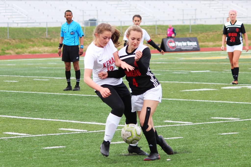 Kenais Rileigh Pace (left) and Juneaus Kyla Bentz (right) battle for the ball in a Friday, May 24, 2019 semifinal game during the Division II state soccer championship tournament at Service High School in Anchorage, Alaska. (Photo by Megan Pacer/Homer News)