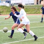 Soldotnas Katherine Bramante and Thunder Mountains Keana Villanueva race to the ball during a semifinal game at the Division II state soccer championships Friday, May 24, 2019 at Service High School in Anchorage, Alaska. (Photo by Megan Pacer/Homer News)