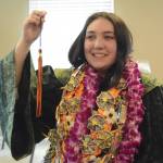 Hailee Fisher poses for a photo after graduation ceremonies on Wednesday, May 22, 2019, at Lands End Resort in Homer, Alaska. Fisher made her own robe with help from Flex counselor Ingrid Harrald. (Photo by Michael Armstrong/Homer News)