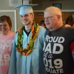 Graduate Sean Moran, second from left, poses with his family after at graduation ceremonies on Wednesday, May 22, 2019, at Lands End Resort in Homer, Alaska. At left is his mother, Amanda Moran, at far right is his brother, Joseph Moran, and second from right is his father, Donald Moran. (Photo by Michael Armstrong/Homer News)