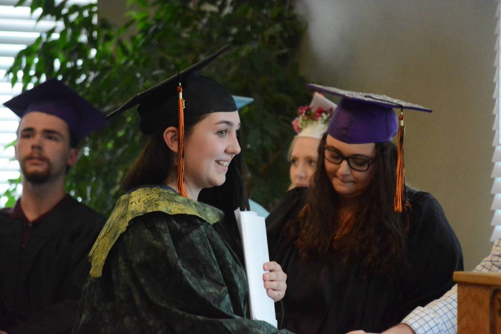 Hailee Fisher receives her diploma from Flex School Principal Christopher Brown at graduation ceremonies on Wednesday, May 22, 2019, at Lands End Resort in Homer, Alaska. (Photo by Michael Armstrong/Homer News)