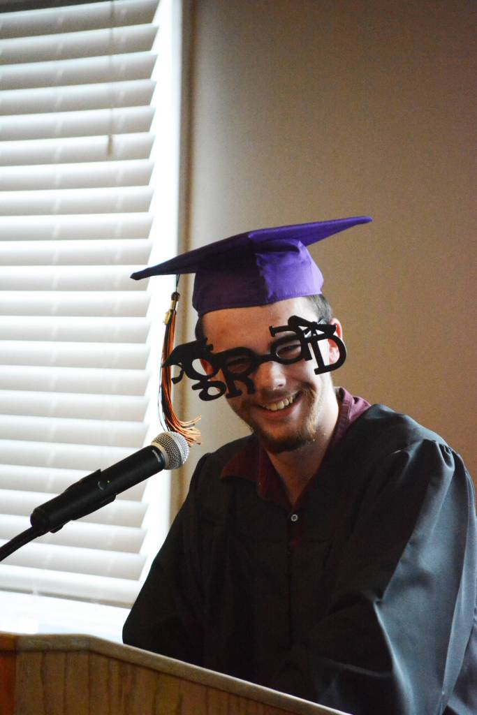 Colten Morris wears goofy glasses while he gives his graduation speech for the Flex School commencement ceremonies on Wednesday, May 22, 2019, at Lands End Resort in Homer, Alaska. In the small graduating classes of Flex, its traditional for graduates to each have the opportunity to speak. (Photo by Michael Armstrong/Homer News)