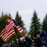 Members of the Veterans of Foreign Wars, the American Legion, Homer and Ninilchik posts, the American Legion Auxiliary and the Sons of the American Legion hold an honor guard at Memorial Day ceremonies on Monday, May 27, 2019, at Hickerson Memorial Cemetery in Homer, Alaska. About 75 people braved a blustery wind to attend the ceremonies. (Photo by Michael Armstrong/Homer News)