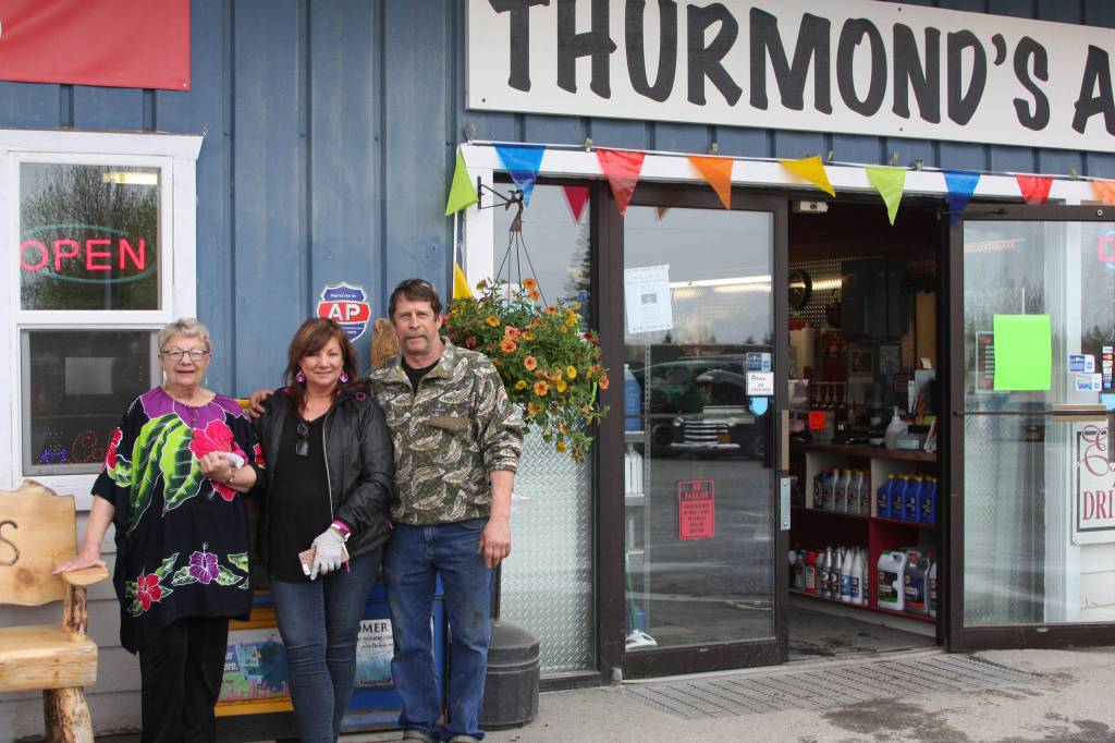 From left to right, Vanita Thurmond, Elaine Griner, and Dale Griner stand outside Thurmonds Far West Auto in Anchor Point, Alaska at the fifth annual Customer Appreciation Day on Saturday, May 25, 2019. (Photo by Delcenia Cosman)