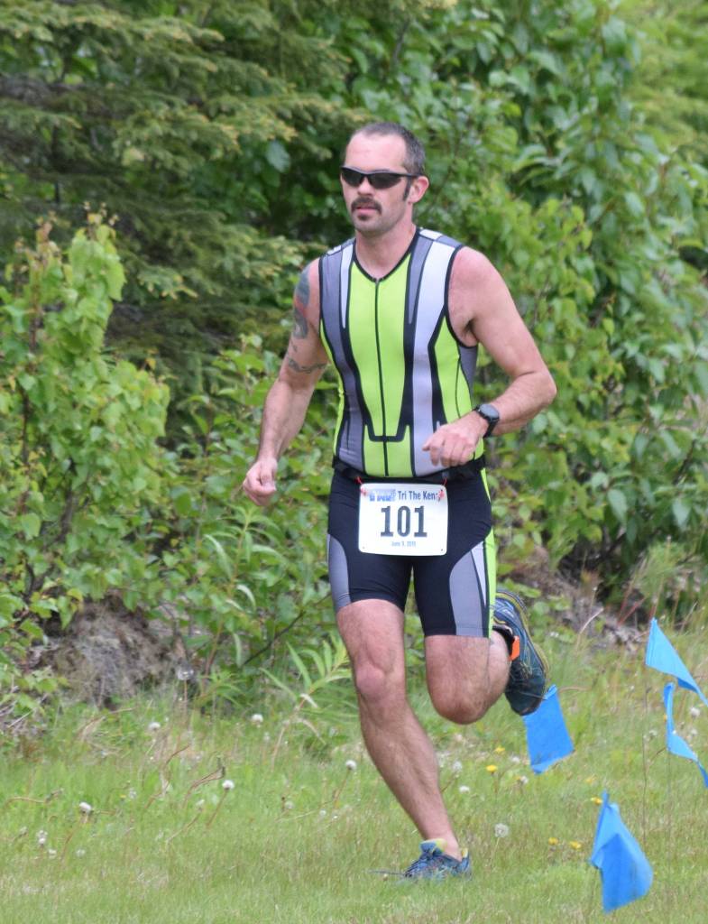 Kenais Jason Moore completes a lap of the run leg Sunday, June 9, 2019, in the Tri-The-Kenai Triathlon in Soldotna, Alaska. (Photo by Joey Klecka/Peninsula Clarion)