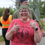 Starla Franklin gives a thumbs-up after crossing the finish line of the 2019 5K Clam Scramble on Saturday, June 15, 2019, in Ninilchik, Alaska. (Photo by McKibben Jackinsky)