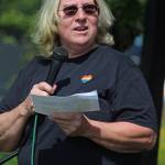 Martie Krohn speaks to a crowd of people before the second Homer Pride Walk on Saturday, June 22, 2019 at WKFL Park in Homer, Alaska. (Photo by Megan Pacer/Homer News)