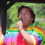 Homer High School graduate Falcom Greear performs a song ahead of this years Pride Walk on Saturday, June 22, 2019 at WKFL Park in Homer, Alaska. (Photo by Megan Pacer/Homer News)