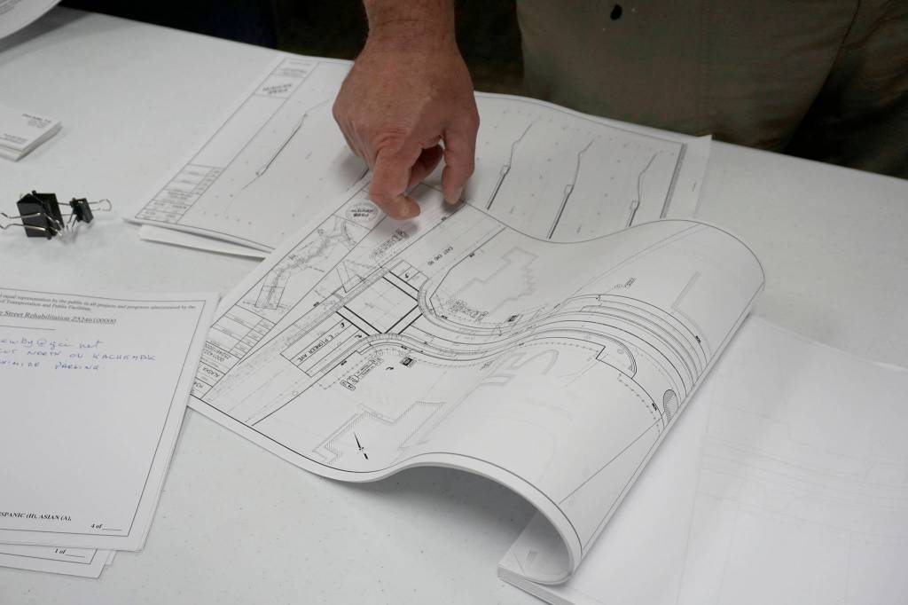 Homer Mayor Ken Castner points to a map with showing the Pioneer Avenue and Lake Street intersection as he talks about the Lake Street rehabilitation project with Alaska Department of Transportation and Public Facilities Project Manager Clint Adler at a public meeting on current and upcoming ADOT&PF projects on June 25, 2019, at Homer City Hall, Homer, Alaska. (Photo by Michael Armstrong/Homer News)