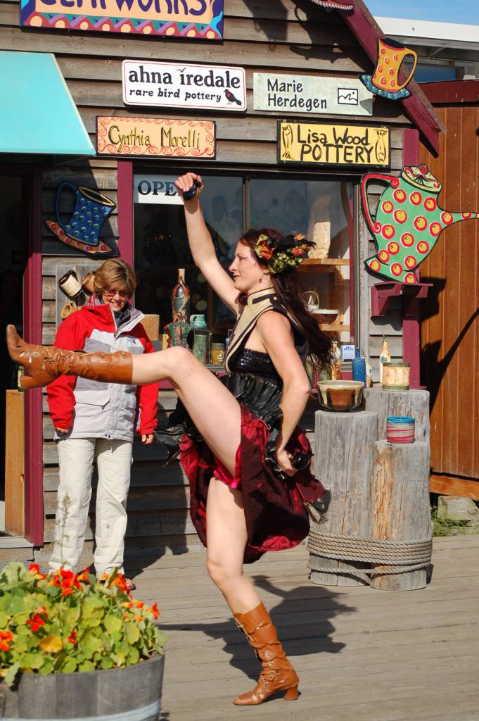 A member of the New Old Time Chautauqua parades down the Homer Spit on its visit in August 2011 in Homer, Alaska. (Homer News file photo)