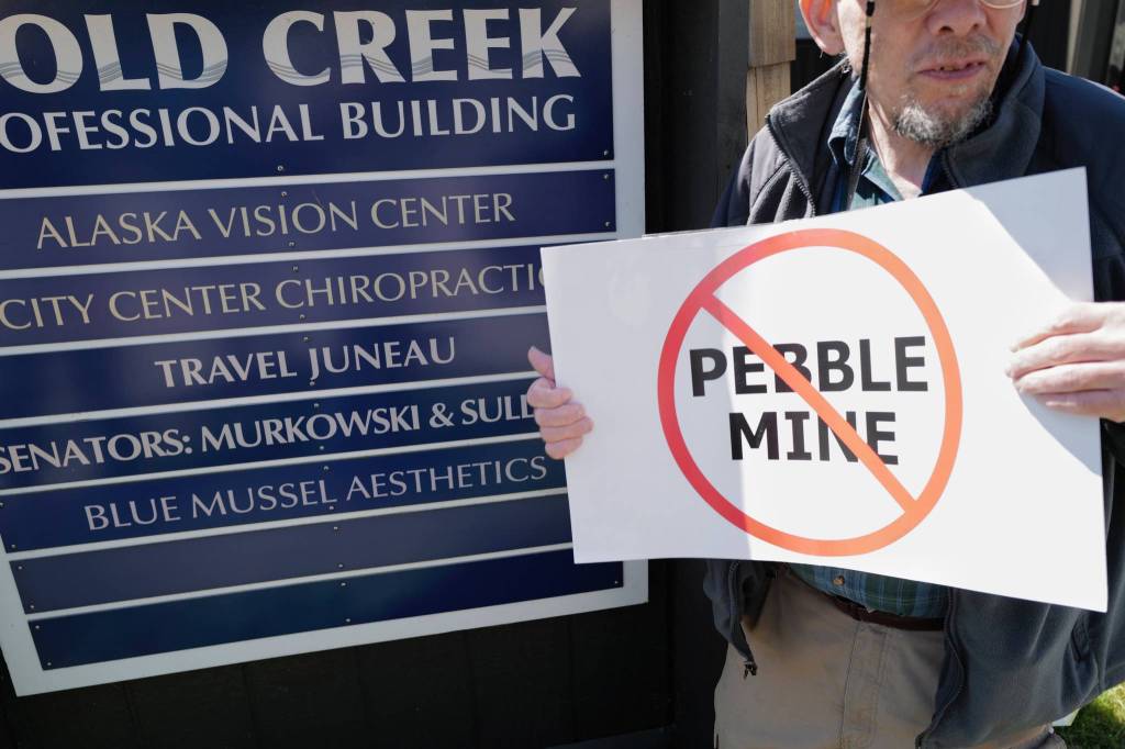 Patrick Kearney gathers for a rally against the Pebble Mine in front of Sen. Lisa Murkowskis Juneau office on Tuesday. (Michael Penn | Juneau Empire)