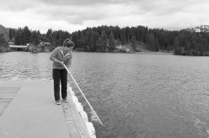 Grace Allan, Kachemak Bay National Estuarine Research Reserve technician, collects a phytoplankton sample on June 7, 2017, in Seldovia, Alaska. (Photo provided)