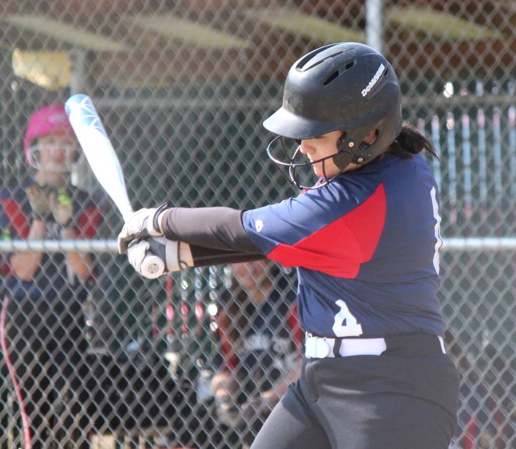 AK Riptides Tammy Frates puts power into her swing as the Kenai-Soldotna team played against Homers Tsunami on Saturday, June 29, 2019, at Jack Gist Field in Homer, Alaska. (Photo by McKibben Jackinsky)
