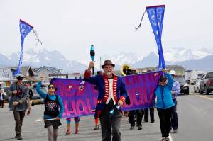 The New Old Time Chautauqua Fighting Instruments of Karma Marching Chamber Band Orchestra marches on the Homer Spit on July 2, 2019, in Homer, Alaska. The group visited Homer as part of a week-long tour partially funded by the Rasmuson Foundations Harper Arts Touring Fund, administed by the Alaska State Council on the Arts  an example of state-foundation cooperation in arts funding. (Photo by Michael Armstrong/Homer News)