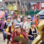 The New Old Time Chautauqua Fighting Instruments of Karma Marching Chamber Band Orchestra marches along the Homer Harbor on July 2, 2019, in Homer, Alaska. (Photo by Michael Armstrong/Homer News)