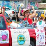 Homer Farmers Market Director Robbi Mixon celebrates on a float in this years July Fourth parade, hosted by the Homer Chamber of Commerce, on Thursday, July 4, 2019 on Pioneer Avenue in Homer, Alaska. (Photo by Megan Pacer/Homer News)