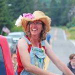 Kyra Wagner, the grand marshal for this years July Fourth parade hosted by the Homer Chamber of Commerce, smiles while riding along the parade route Thursday, July 4, 2019 on Pioneer Avenue in Homer, Alaska. (Photo by Megan Pacer/Homer News)