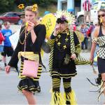 A group of parade participants marsh dressed as bees to raise awareness for supporting the insects and agriculture in general during this years July Fourth parade Thursday, July 4, 2019 on Pioneer Avenue in Homer, Alaska. (Photo by Megan Pacer/Homer News)