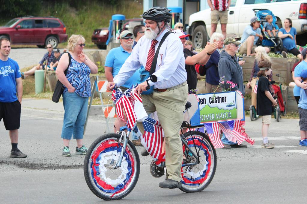 Homer Mayor Ken Castner cycles down Pioneer Avenue during this years July Fourth parade, hosted by the Homer Chamber of Commerce, on Thursday, July 4, 2019 in Homer, Alaska. (Photo by Megan Pacer/Homer News)