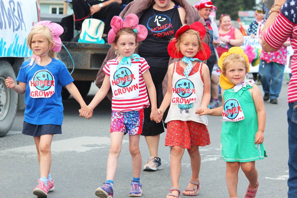 Photos by Megan Pacer / Homer News                                A group of girls walking with the Zumba in Homer display their Homer Grown signs during the July Fourth parade on Thursday, July 4, 2019 on Pioneer Avenue in Homer, Alaska. The Zumba in Homer float won the prize for Best Childrens Group.