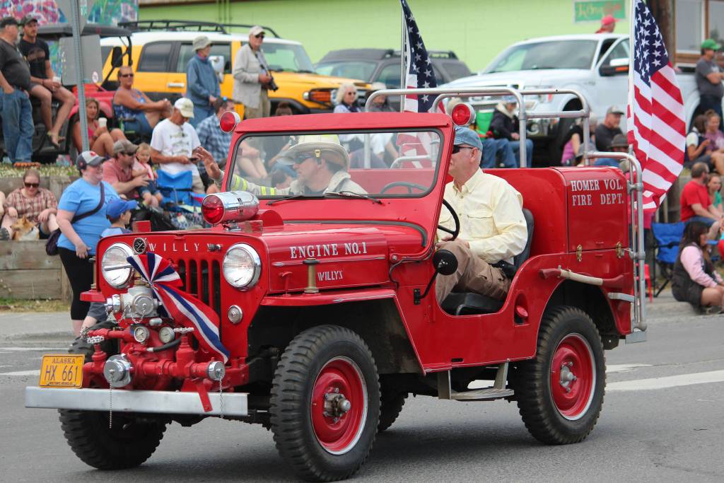 A historic fire engine makes its way along Pioneer Avenue during this years July Fourth parade on Thursday, July 4, 2019 in Homer, Alaska. (Photo by Megan Pacer/Homer News)