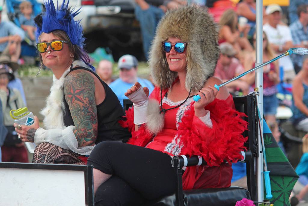 Participants in this years July Fourth parade hosted by the Homer Chamber of Commerce ride in a float on Thursday, July 4, 2019 down Pioneer Avenue in Homer, Alaska. (Photo by Megan Pacer/Homer News)