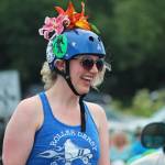 A member of the Spit City Sirens roller derby team skates through this years July Fourth parade, hosted by the Homer Chamber of Commerce, on Thursday, July 4, 2019 on Pioneer Avenue in Homer, Alaska. (Photo by Megan Pacer/Homer News)