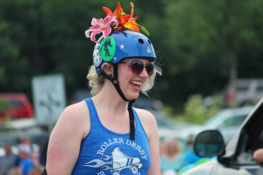 A member of the Spit City Sirens roller derby team skates through this years July Fourth parade, hosted by the Homer Chamber of Commerce, on Thursday, July 4, 2019 on Pioneer Avenue in Homer, Alaska. (Photo by Megan Pacer/Homer News)