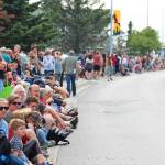 People line Pioneer Avenue wait in anticipation of this years July Fourth parade on Thursday, July 4, 2019 in Homer, Alaska. (Photo by Megan Pacer/Homer News)