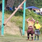 Robert Moody throws a caber while a judge looks on during the mens caber toss event at this years Kachemak Bay Highland Games on Saturday, July 6, 2019 at Karen Hornaday Park in Homer, Alaska. (Photo by Megan Pacer/Homer News)