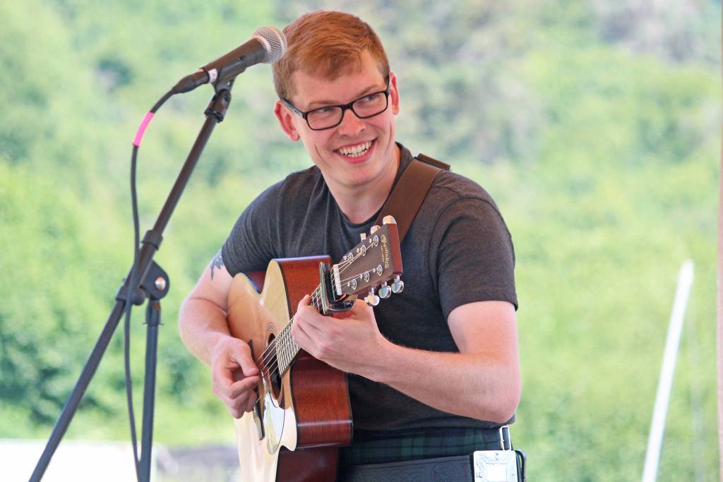 Adam Hendey performs with the Scottish music band The Fire during the annual Kachemak Bay Highland Games on Saturday, July 6, 2019 at Karen Hornaday Park in Homer, Alaska. (Photo by Megan Pacer/Homer News)