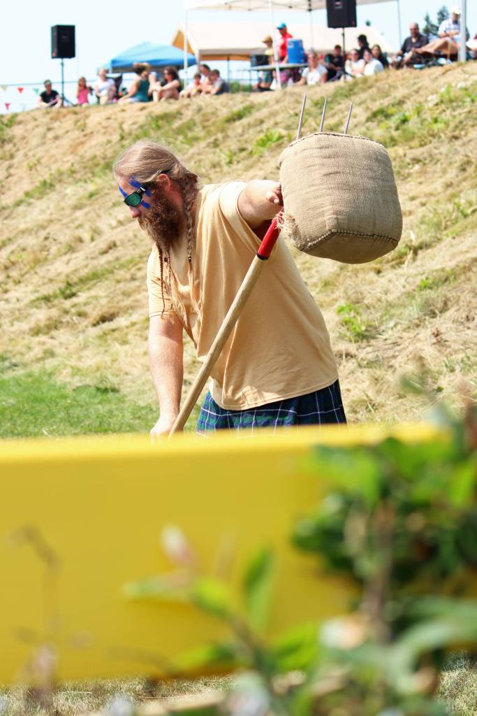 Charles Knefelkamp prepares to toss a 20-pound sheaf into the air during the mens sheaf toss event at the Kachemak Bay Highland Games on Saturday, July 6, 2019 in Homer, Alaska. Knefelkamp took fifth place in the Mens Open class. (Photo by Megan Pacer/Homer News)