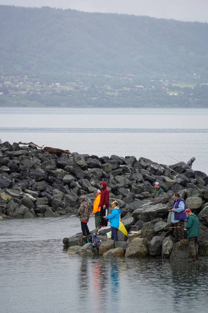 Photo by Michael Armstrong/Homer News                                Anglers fish on Monday, July 15 at the mouth of the Nick Dudiak Fishing Lagoon in Homer. Rain fell over the weekend after a weeks-long stretch of sunny weather.