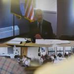 University of Alaska Southeast administrators and staff watch University President Jim Johnsen during an online meeting being held at UA campuses around the state on Gov. Mike Dunleavys budget cuts on Monday, July 15, 2019. (Michael Penn | Juneau Empire)