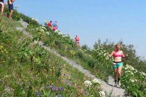 Kat Sorensen runs along a crossover trail on the descent on July 4, 2019, during the 92nd Mount Marathon Race in Seward, Alaska. (Photo courtesy of Kat Sorensen)