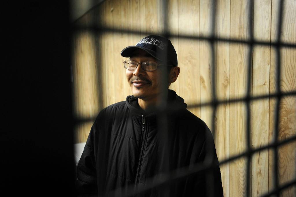 In this Thursday, June 27, 2019 photo, Stebbins Village Police Officer John Aluska provides a tour of the public safety building, in Stebbins, Alaska. Aluska has a criminal record but said it does not interfere with his police work. At least 14 cities in Alaska have employed police officers whose criminal records should have prevented them from being hired under state law, the Anchorage Daily News and ProPublica reported Saturday, July 20, 2019. (Bill Roth/Anchorage Daily News via AP)