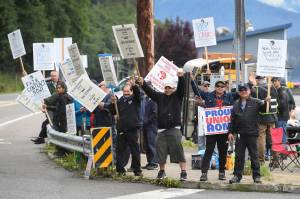 Members of the Inland Boatmens Union of the Pacific picket in front of the Auke Bay Terminal on Thursday, July 25, 2019. The union called a strike on Wednesday over failed negotiations with Gov. Mike Dunleavys administration. (Michael Penn | Juneau Empire)