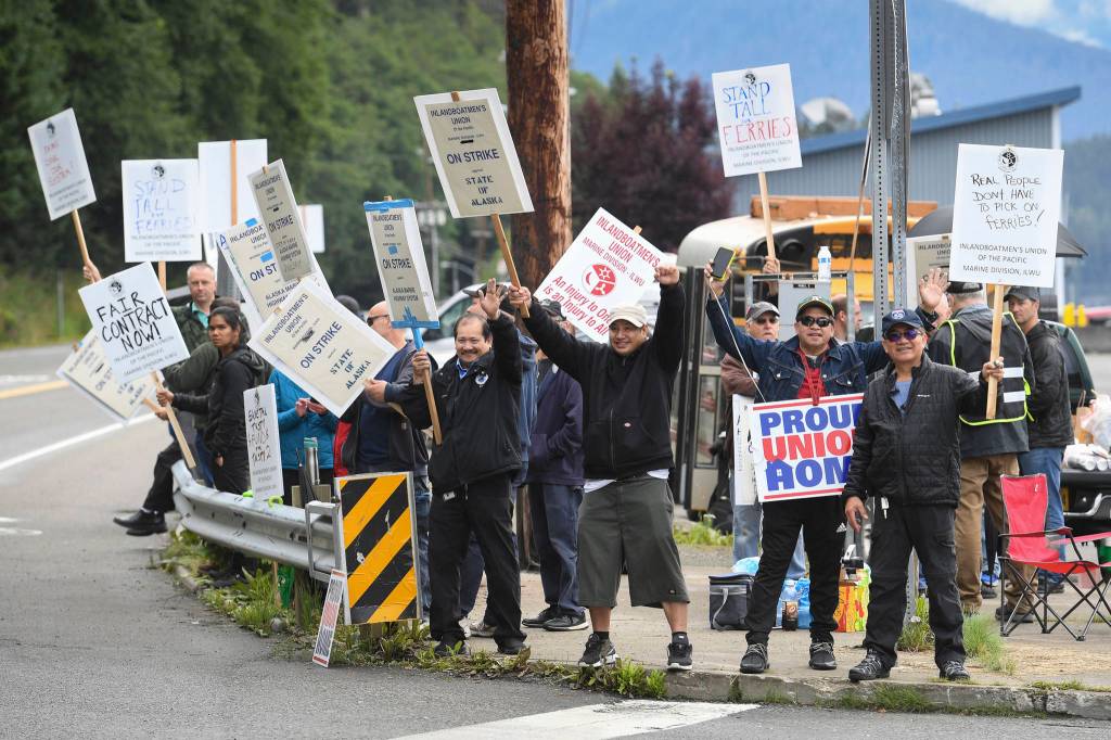 Members of the Inland Boatmens Union of the Pacific picket in front of the Auke Bay Terminal on Thursday, July 25, 2019. The union called a strike on Wednesday over failed negotiations with Gov. Mike Dunleavys administration. (Michael Penn | Juneau Empire)