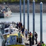 Emergency medical technicians help victims of a boat capsizing up the Homer Harbor load and launch ramp on Tuesday afternoon, July 30, 2019, in Homer, Alaska. Crews in three Good Samaritan boats, from front to back, the Torega, the Grotta Nove, and the Seabird, rescued five people from an overturned skiff near China Poot Bay. (Photo by Michael Armstrong/Homer News)