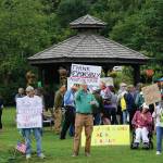 Recall Dunleavy supporters hold signs at a Recall Dunleavy rally held on Aug. 1, 2019, at WKFL Park in Homer, Alaska. (Photo by Michael Armstrong)