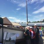 From left, Tim Troll, Kate Mitchell and Dave Seaman, stand in front of LML 144 on Sunday, Aug. 4, 2019, at Salmonfest in Ninilchik, Alaska. They are organizing Sailing Back to the Bay 2020, which will take the one-time fishing vessel from Homer to Bristol Bay. (Photo by McKibben Jackinsky)