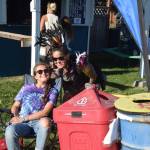 Photo by Brian Mazurek/Peninsula Clarion                                 Rosie Skovron, left, and a Salmonfest attendee smile for the camera at one of the waste disposal stations during Salmonfest 2019 in Ninilchik, Alaska on August 2, 2019. Skovron is a volunteer for the Zero Waste project and an intern at Cook Inletkeeper.