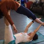 Joolee Aurand, on bottom, demonstrates a yoga pose in this undated photo taken in Homer, Alaska. (Photo provided)