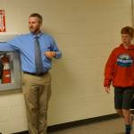 Music teacher Eric Simonson directs students to band and choir classes at the start of the new school year on Tuesday, Aug. 20, 2019, at Homer Middle School in Homer, Alaska. (Photo by Michael Armstrong/Homer News)