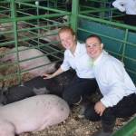 Bailey Epperheimer and Judah Johnston pose with Epperheimers pigs, Maui and Chancho, at the Kenai Peninsula Fair on Saturday, Aug. 17, 2019 at the fairgrounds in Ninilchik, Alaska. (Photo by Brian Mazurek/Peninsula Clarion)