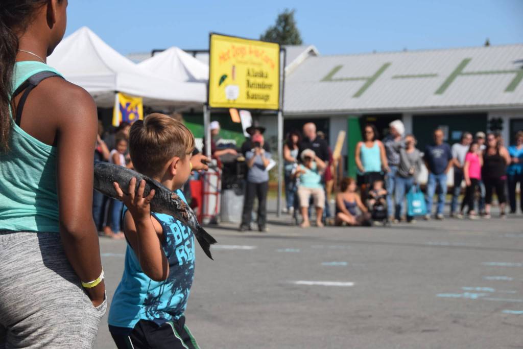 A participant tries his hand at the fish throwing competition at the Kenai Peninsula Fair on Saturday, Aug. 17, 2019 at the fairgrounds in Ninilchik, Alaska. (Photo by Brian Mazurek/Peninsula Clarion)